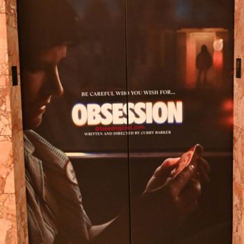 A promotional poster for the film 'Obsession', featuring a close-up of a person's side profile holding a playing card and a shadowy figure in the background. The text reads 'BE CAREFUL WHO YOU WISH FOR... OBSESSION' along with details about the film's release.