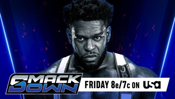 A muscular wrestler named Royce Keys, formerly known as Powerhouse Hobbs, stares intensely at the viewer against a blue background featuring dynamic lighting. He is wearing a black and white outfit with straps and is prominently displayed, emphasizing his physique.